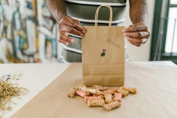 whippet-food-allergies Chef preparing dog treat bag